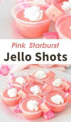 pink starburst jello shots with marshmallows in them on a white plate