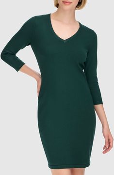 Enjoy the versatility of this V-neck sweater-dress knit from soft, lightweight yarns in a stretchy body-con silhouette. 36" length Slips on over head V-neck Three-quarter sleeves Unlined 75% rayon, 25% nylon Machine wash, line dry Imported Casual V-neck Elastane Mini Dress, Seamless V-neck Bodycon Dress, Seamless Fitted V-neck Mini Dress, Seamless Fitted V-neck Bodycon Dress, Fitted Seamless V-neck Mini Dress, Green V-neck Stretch Bodycon Dress, Green V-neck Elastane Dress, Green V-neck Mini Dress For Fall, Stretch V-neck Mini Dress For Fall