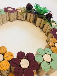 several wine corks arranged in the shape of a wreath on top of a table