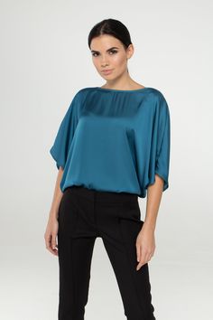 "A soft satin blouse featuring a boat neckline, half dolman sleeves, loose silhouette, and a relaxed fit. - kimono style blouse - loose silhouette - boat neck - half sleeves - Color: blue Fiber: 30% viscose, 70 % polyester. You may feel free choosing the size. Just send us your measurements (bust, waist, hips, height). We will define your correct size. SIZE CHART XS __ EU 34 __ US 4 bust: 31,5\" | 80 cm waist: 24,5\" | 62 cm hips: 34,5\" | 88 cm S __ EU 36 __ US 6 bust: 33,0\" | 84 cm waist: 26, Elegant Blue Viscose Blouse, Blue Batwing Sleeve Blouse For Summer, Blue Batwing Sleeve Blouse For Spring, Elegant Batwing Sleeve Party Tops, Blue Summer Blouse With Batwing Sleeves, Chic Boat Neck Top For Work, Elegant Batwing Sleeve Tops For Spring, Elegant Batwing Sleeve Top For Work, Elegant Blue Viscose Tops