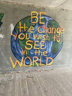 graffiti on the side of a building reads be the change you wish to see in the world