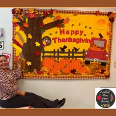 a woman sitting on a bench in front of a happy thanksgiving bulletin board with an image of a truck and pumpkins