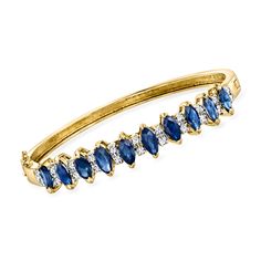 Ross-Simons - C. 1980 Vintage 5.50ct t. w. Sapphire, .55 ct t. w. Diamond Bangle Bracelet. 6". C. 1980. Sumptuous sapphires all in a row! From our Estate collection, this riveting bangle bracelet boasts 5.50 ct. t. w. marquise sapphires with .55 ct. t. w. round brilliant-cut diamonds twinkling in between. Finely crafted in polished 14kt yellow gold. Graduates from 1/8" to 3/8" wide. Hinged with a figure 8 safety. Box clasp, diamond and sapphire bangle bracelet. Exclusive, one-of-a-kind Estate Je Classic Gemstone Bangle For Anniversary, Classic Formal Bangle With Gemstone, Fine Jewelry Sapphire Bangle Bracelet, Luxury Gold Diamond Bracelet With Sapphire, Yellow Gold Sapphire Diamond Bracelet, Elegant Yellow Gold Sapphire Tennis Bracelet, Yellow Gold Sapphire Bracelet, Sapphire Bangle, Sapphire Birthstone