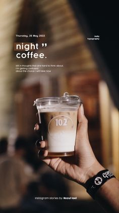 a hand holding a cup of coffee with the words night coffee written on it and people in the background