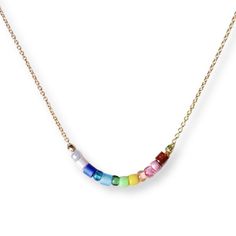 Rainbow Necklace I call these little beaded necklaces "Color Flights" - almost like a mood ring for your neck! Feeling like a rainbow today? Perfect! Here is the necklace for you. A hand selected grouping of glass beads in rainbow colors are carefully strung on a dainty gold filled cable chain. Beaded area measures a little over 1" across. Necklace Details: ► Adjustable 16" or 18" length ► All components are gold filled ► Spring ring closure ► Hand formed and hammered in Nashville, TN ABOUT US T Rainbow Necklaces With Spacer Beads For Jewelry Making, Rainbow Crystal Necklaces With Colorful Beads For Gift, Adjustable Rainbow Necklaces With Spacer Beads, Adjustable Rainbow Necklace With Colorful Beads, Rainbow Colorful Beads Necklaces For Jewelry Making, Rainbow Beaded Chain Necklace With Round Beads, Rainbow Colorful Beaded Necklaces For Jewelry Making, Everyday Rainbow Beaded Jewelry, Everyday Multicolor Jewelry With Tiny Beads