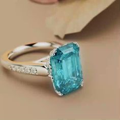 an oval cut blue topaz ring with diamond accents