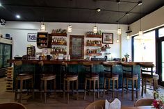 a bar with several stools in front of it