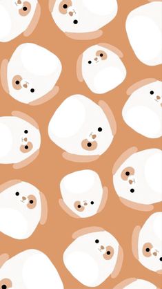 a group of white bears with black dots on them's eyes and nose are shown in the center of an orange background