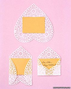 three pieces of paper with doily on them and two envelopes in the middle