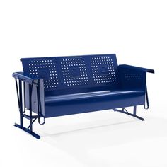 a blue bench sitting on top of a white floor next to a metal frame fence