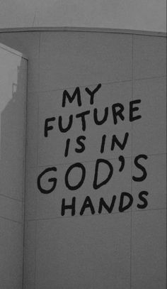 a black and white photo with the words my future is in god's hands