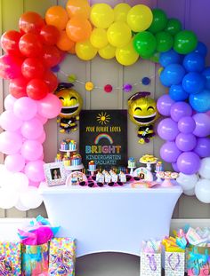 a birthday party with balloons and decorations