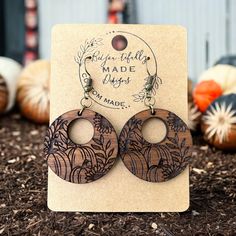 Welcome to BeYou-tifully Made Designs! Add a touch of natural beauty to your style with these exquisite handcrafted earrings made from solid walnut. Featuring an intricate fall-inspired design with pumpkins and floral engravings, these earrings are a perfect addition to your autumn wardrobe. Features: *Material: Solid walnut wood *Design: Detailed pumpkin and floral motifs *Earring Type: Drop earrings *Hardware: Hypoallergenic findings for comfortable wear *Size: 1.75 inches in length x 1.25 inc Brown Jewelry Gift For Fall, Brown Jewelry For Fall Season Gift, Brown Jewelry For Fall Gifts, Thanksgiving Earrings, Glow Forge, Laser Projects, Laser Ideas, Earrings Fall, Wooden Pumpkins