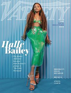 the cover of vanity magazine features a woman in a green dress