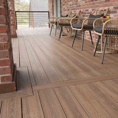 an outdoor deck with wicker chairs and tables