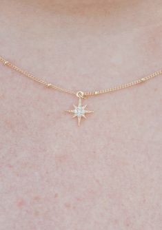 "This is the sweetest necklace! It feels like a little dash of sparkle on your neck! A tiny delicate Crystal North Star Charm measuring 11 mm by 9 mm dangles from a gold filled ball chain. Choose your length. The most famous star in Ursa Minor is Polaris, the North Star. This is the star that is nearest to the North Celestial Pole. If you stood at the north pole, Polaris would be almost directly overhead. If you can spot Polaris in the sky, you can always tell which way is north. In addition, th Dainty Sparkling Star-shaped Jewelry, Dainty Sparkling Star Jewelry, Cute Gold Jewelry With Star Charm, Dainty Star Charm Necklaces, Delicate Star Charm Necklace For Everyday, Everyday Delicate Star Charm Necklaces, Cute Gold Star Jewelry, Dainty Star Charm Necklace, Dainty Star Necklace For Everyday Wear