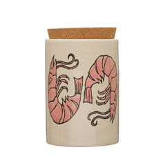 a ceramic jar with the word go written on it and two large pink shrimps