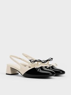 Bows are huge this season. Step into the trend with these Dorri slingback pumps, featuring not just one, but two delicate bows in contrasting colours, exuding twice the feminine flair. Another highlight of the Dorri is their two-toned design, injecting the shoes with stylish flair and setting them apart from other slingback pumps. In classic black and white, they are versatile enough to complement a wide range of outfits without appearing boring. Wardrobes Uk, Charles And Keith Shoes, Charles And Keith, Shoe Wishlist, Online Shopping Shoes, Shoes World, Double Bow, Shop Shoes, Wedding Heels