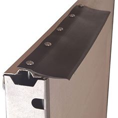 an aluminum gutter door handle is attached to the side of a building with holes in it