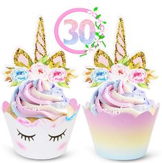 two cupcakes with unicorn decorations on them