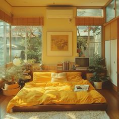 a bed sitting in a bedroom next to a window with lots of plants on top of it