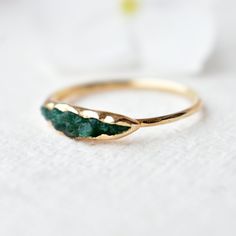 "This one-of-a-kind pea-pod ring is crafted in solid 14k yellow gold pod with rough Emerald peas filled in the pod. Its raw beauty holds a mystery. A unique gift for all the mothers and grandmothers for the lifetime of nurturing they provide!  THIS RING IS READY TO SHIP IN 14K YELLOW GOLD, US 7.  *  Gold: 14k / 18k Solid Gold  *  Gold Colour: Yellow / Rose / White  *  Gold Wt.: ~1.51 gm (14kt) *  Gemstone: Natural Genuine Diamond *  Diamond Wt.: ~0.65 Ct * Authenticity Check: This ring will be marked for gold  RETURNS/EXCHANGES: - Please read the policies before placing the order. If you have any questions, please message.  PACKAGING: > Each package includes a jewellery box. SHIPPING: > Import duties and taxes (if any) ARE NOT INCLUDED. Please check the same for your country (especially UK Rough Emerald Jewelry, Raw Rings, Jade Rings For Women, Unique Mothers Rings, Raw Emerald Ring, Emerald Gold Ring, Turquoise Ring Engagement, Gold Ring Unique, Natural Emerald Rings