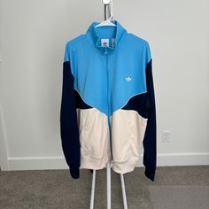 Adidas Adicolor Cutline Track Top New With Tags. Navy/Bright Blue/Off White Color. Rare Find. Blue Long Sleeve Track Jacket For Streetwear, White Color Block Long Sleeve Track Jacket, White Long Sleeve Color Block Track Jacket, Sporty Light Blue Cotton Outerwear, Fitted Blue Track Jacket For Streetwear, Blue Cotton Long Sleeve Track Jacket, Blue Retro Track Jacket For Spring, Casual Color Block Track Jacket For Spring, Blue Color Block Track Jacket