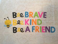 the words be brave, be kind and be a friend written in multicolored letters