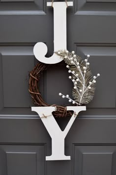 a door with a wreath and letter y on it