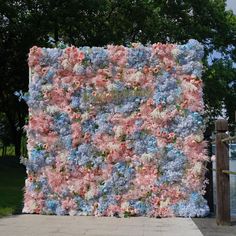 a large piece of art made out of flowers