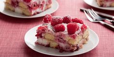 a piece of cake with raspberries on top