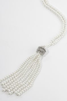 This sumptuous piece of jewelry features a retro-elegant yet slightly modern style that complements the lavish garments, reminiscent of the roaring 1920s. Features: Lustrous imitation pearls Delicate pearl tassels design High quality crystal 15 inch / 38cm long 1920 Accessories, Roaring 20s Jewelry, 20s Jewelry, Tassels Design, Pearl Tassels, Roaring 1920s, 1920s Jewelry, Your 20s, Roaring 20s