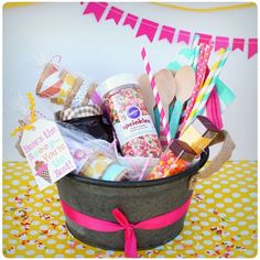 a basket filled with lots of different items on top of a yellow and white table cloth