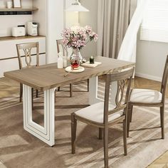 a dining room table and chairs with flowers in vases on the top one side