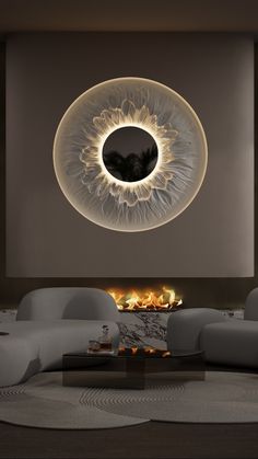 a living room filled with furniture and a fire place in front of a circular light fixture