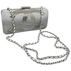 A piece as rarely seen. Chanel has outdone herself in this silver and white minaudiere. On the one hand, a large silver CC shiny on the top then subtly rounded white on the bottom and the bottom is rounded white on the top and silver on the bottom in a gradient. A real artistic work which makes it a collector's item. The back is domed in white on the top in gradient also and silver on the bottom. the interior of this evening bag is impeccable ivory satin. The shiny silver clasp signed CHANEL clo African American Braided Hairstyles, Jaguar Type E, Jaguar Type, Silver Pants, Chanel Clutch, Chanel Suit, Chanel Runway, Chanel Box, Chanel Vintage