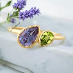 Vintage Pear-Shaped Alexandrite Engagement Ring Yellow gold art deco Peridot ring pear Bezel Set Gold rings unique anniversary bridal ring Brand - LATELIERDBIJOUX Type Of Stone - Alexandrite Cut of Stones - Pear Stone Creation - Lab Creation Stone size - 7 x 5 mm  Stone Color - Purple Birthstone - June  Second Stone - Peridot (lab Created) Second Stone shape - Pear Second Stone Color - Green Check out my other items!   PAYMENTS We accept PayPal, If we do not receive payments immediately we will Engagement Ring Yellow Gold, Engagement Ring Yellow, Rings Unique, Alexandrite Engagement Ring, Gold Art Deco, Yellow Gold Engagement Rings, Peridot Ring, Types Of Stones, Gold Art