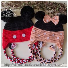 two crocheted mickey mouse hats on top of each other with bows and ears