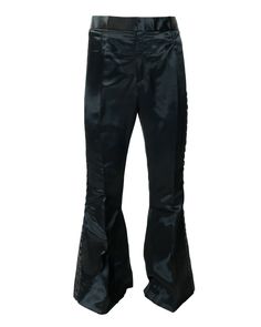 These super shiny black satin bell-bottom flares were made in the 90s but are reproduction of a 1970's stage garment. Perfect for a 1970s party. Details: There is a  sequinned stripe down the side of each leg. There is a hook fastening on the waistband and on the fly. Fabrication: Unknown fabric, but most likely synthetic material Care: Dry clean only Measurements: Mens S/M Waist: 32 inches Seat: 42 inches Length: 43 inches Bellbottom Width: 15 inches Condition: It is in very good vintage condit 1970s Party, Terry De Havilland, Buffalo Boots, Bell Bottom Trousers, Vintage Props, Black Trousers, Bell Bottom, Black Satin, Bell Bottoms