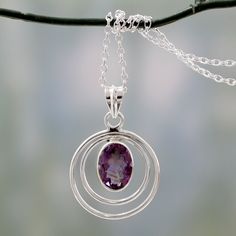 Enveloped in a double halo, amethyst's radiant beauty seduces the senses. India's Alok Jain presents the sumptuous 8-carat gem in a necklace of polished sterling silver. .925 Sterling silver materials: Sterling silver, amethyst Cable chain Spring ring clasp High polish finish 17.75 in. L; 2 mm W; Pendant(s): 1.6 in. L x 1.1 in. W x 0.2 in. D Necklaces Grunge, Amethyst Pendant Necklace, German Silver Jewelry, Silver Jewelry Box, Claddagh Ring, Amethyst Necklace Pendant, Silver Jewelry Design, Silver Jewelry Necklace, Silver Jewellery Sets