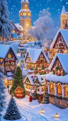 a christmas village with lots of houses and trees covered in snow, lit up by lights