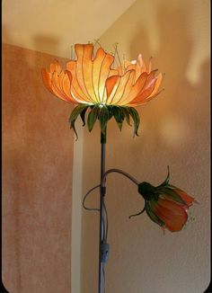 a lamp that is sitting on top of a table next to a wall and floor