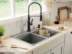 the kitchen sink is clean and ready to be used for cooking or cleaning up some dishes