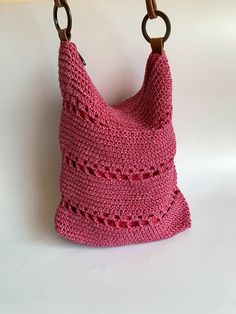 "This is a vintage 90s bright pink crochet tote bag. This slouchy hobo bag has a top zip closure and cotton lining. This crochet shoulder purse has faux leather shoulder strap There is one compartment and one pocket inside.  Era: 90s Condition: This crochet hobo bag is in beautiful vintage condition with no visible signs of wear. Measurements: Width: 9.8\" / 25 cm Hight: 11.8\" / 30 cm Depth: 2.4\" / 6 cm Strap drop: 15.7\" / 40 cm Color: bright pink Materials: crochet thread, cotton lining, faux leather straps, brass rings Shipping: I will ship your item from Varna, Bulgaria. Items shipped within the European Union take around 6-12 working days. Overseas delivery usually takes around 15-21 working days. Depending on the destination country and the postal services it could take longer in s Pink Crochet Knitted Bag For Everyday Use, Handmade Pink Tote Hobo Bag, Pink Bohemian Hobo Bag With Adjustable Strap, Everyday Pink Handwoven Shoulder Bag, Pink Handwoven Crochet Bag For Shopping, Handmade Pink Hobo Shoulder Bag, Bohemian Pink Crochet Bag For Summer, Everyday Pink Knitted Shoulder Bag, Daily Use Pink Handmade Crochet Bag