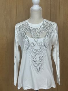 Expertly designed and crafted in Turkey, this Gorgeous white / black blouses boasts sparkling crystals and premium 95% Viscose and 5% Elastane fabric. See through mesh fabric on the sleeves decorated with sparkly beads as well. With a little stretch and light weight, it offers a perfect fit for any special occasion. Elevate your style with this high-quality, elegant piece. Black Blouses, Crystals White, White Long Sleeves, White Long Sleeve Blouse, Sleeves Blouse, Embroidered Wedding, Black And White Blouse, Elastane Fabric, Lace Weddings