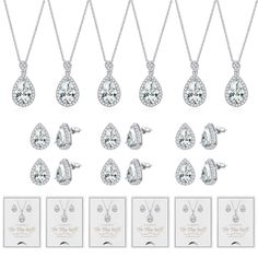 six pairs of earrings and necklaces in white gold with diamonds on each earring