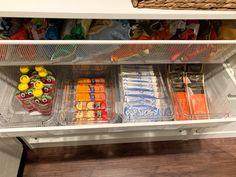 an open refrigerator filled with lots of food and condiments on top of it