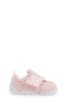 Baby's first steps will be supported in this sporty sneaker featuring a roomy toe box and easy-on/off strap. Adjustable hook-and-loop strap Removable insole Textile and leather upper/synthetic lining/rubber sole Imported Baby's First Step, Sporty Sneakers, Arch Support, New Balance, Pink White, Rubber Sole, Leather Upper, Arch, Size 4