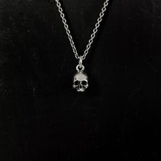 The Mini Skull Necklace features a single anatomical skull, suspended from an oxidized solid sterling silver chain. This anatomical skull is crafted in high detail and shows off the intricacies of the skull from every angle. Skulls have historically been worn as a reminder of one's mortality. Memento mori, latin for “remember that you must die” is a phrase used to remind us of the transient, fleeting nature of life. This skull necklace is a testament to live our lives to the fullest without regr Hellenic Polytheism, Anatomical Skull, Trio Necklace, Buying An Engagement Ring, Skull Jewelry, Skull Necklace, Skull Pendant, Funky Jewelry, Black Necklace