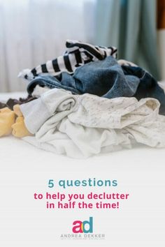 a pile of clothes sitting on top of a bed with the words 5 questions to help you deultter in half the time